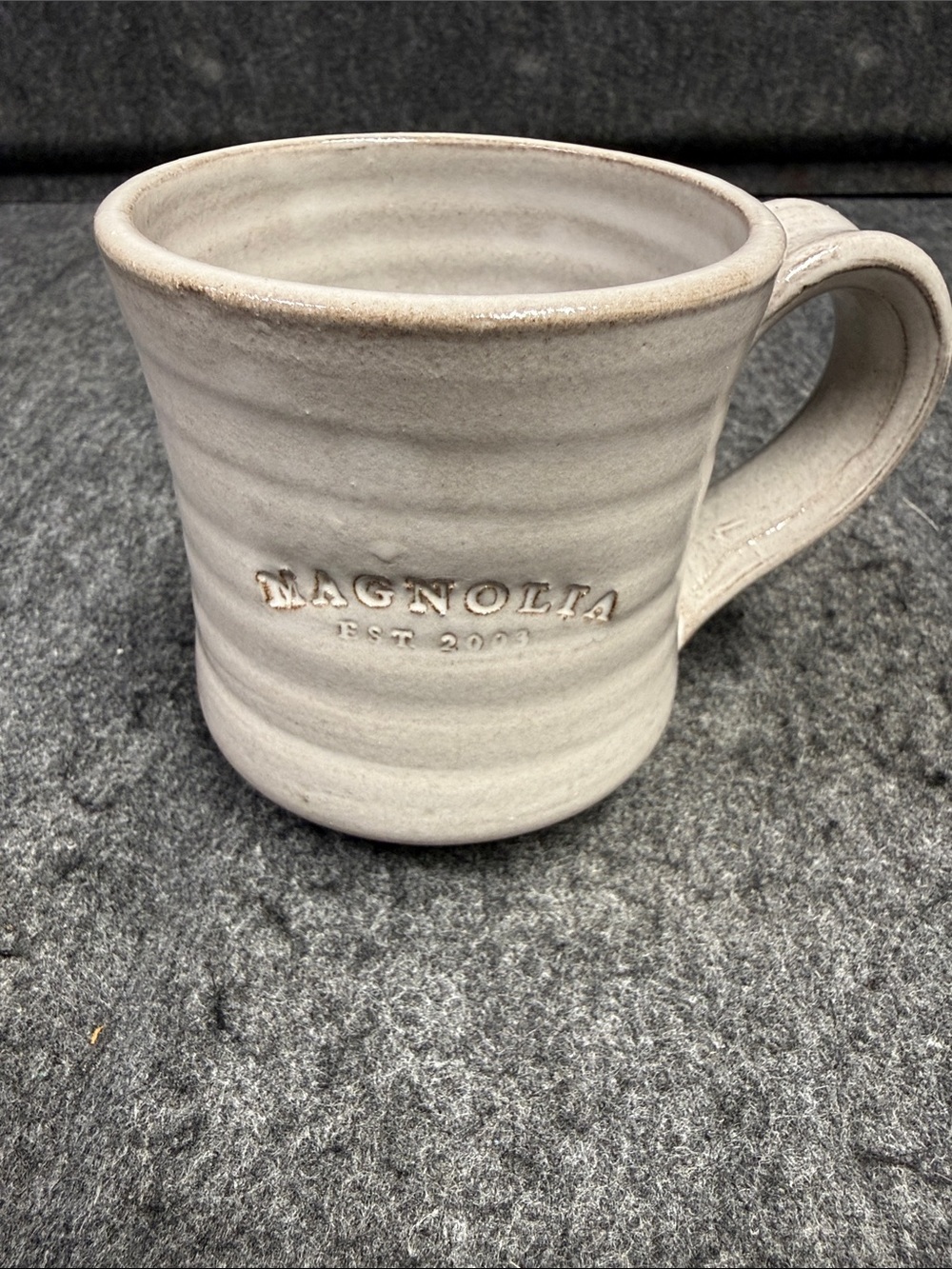 Magnolia White-Cream Stoneware Mug with Embossed Logo